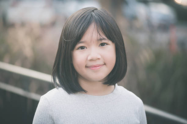 istock little asian girl having fun 648311000