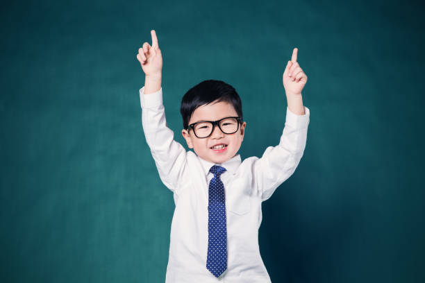 istock Happy little business man smiling with hands raised 648311884