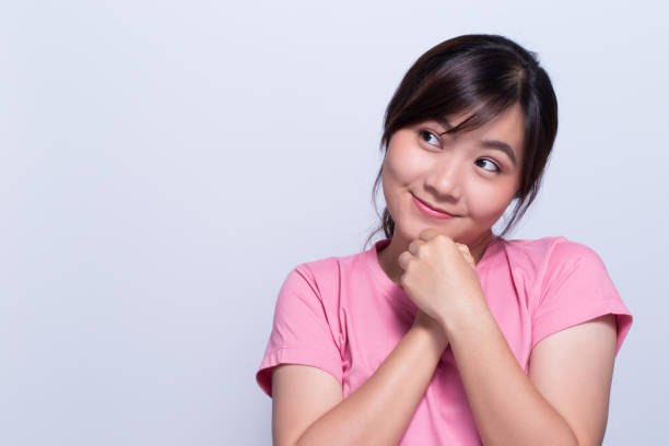 istock Shy woman on isolated background 648314906