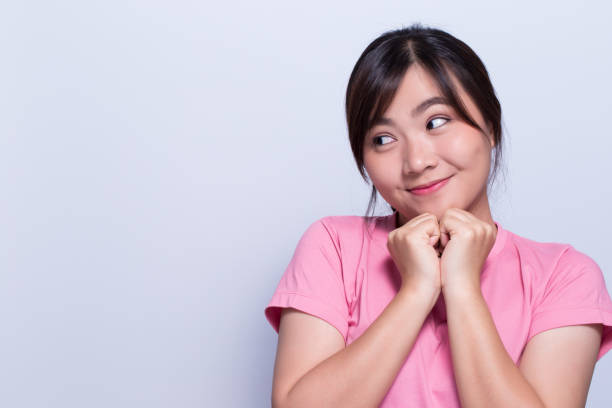 istock Shy woman on isolated background 648315124