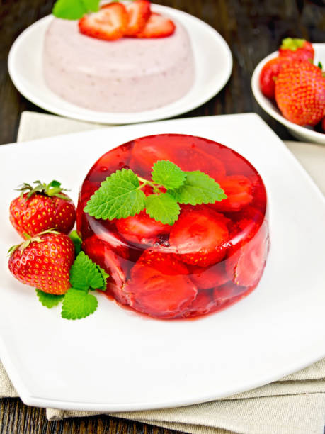 istock Jelly strawberry with mint on dark board 648319190