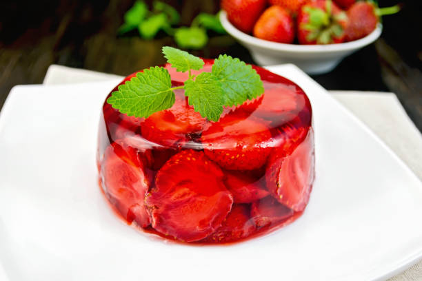 istock Jelly strawberry with mint and berries on board 648319206