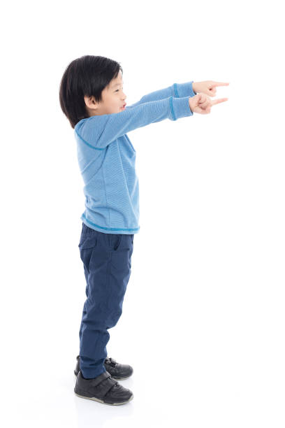 istock Asian child pointing on white background isolated 648319622