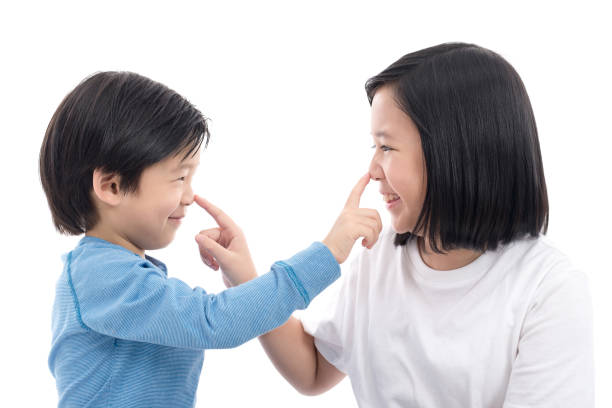 istock asian children sitting on white background 648322170