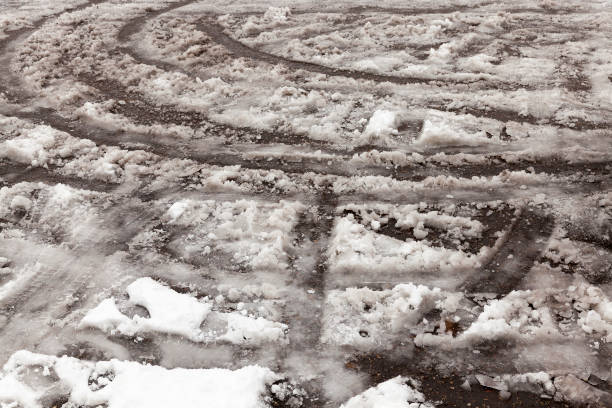 istock traces of the car on snow 648322172
