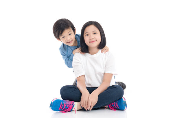 istock asian children sitting on white background 648322180