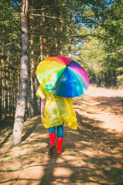 istock Young woman is walking in a forest 648328868