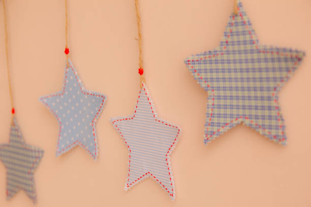Star shaped cloth patches hanging on the wall.