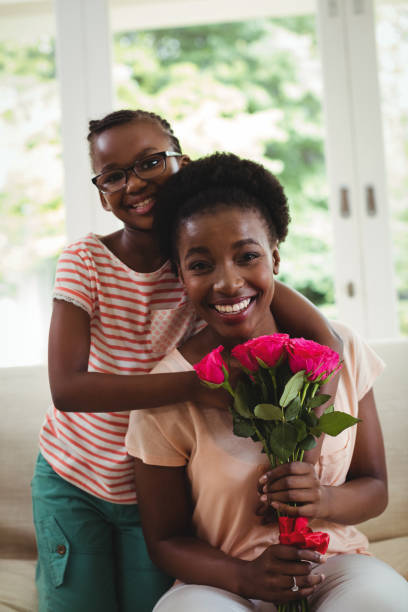 istock Daughter with arms around mother shoulders 648348562