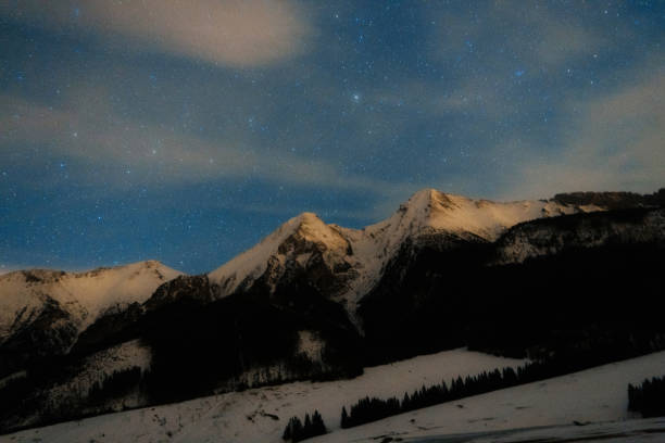 istock Scenic view of mountains at night 648349134
