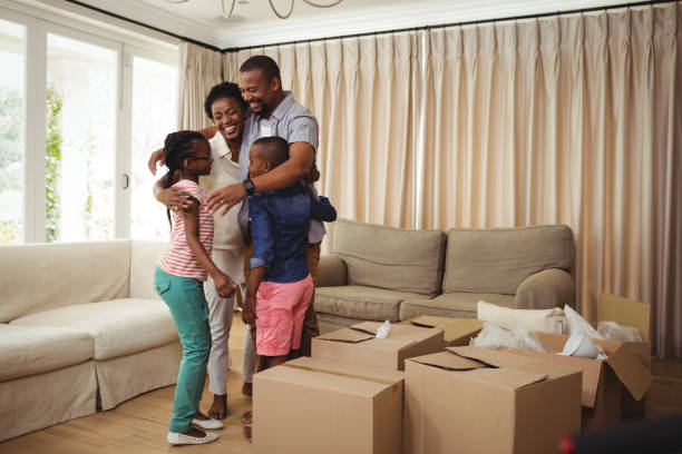 istock Parents and kids hugging each other 648351610