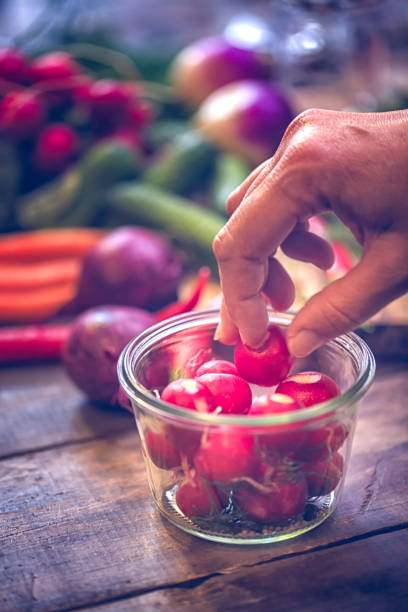 istock Preserving Organic Radishes in Jars 648354970
