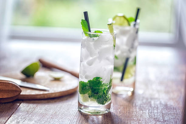 Mojito Cocktail Mojito with white rum, lime, mint and crushed ice mojito stock pictures, royalty-free photos & images