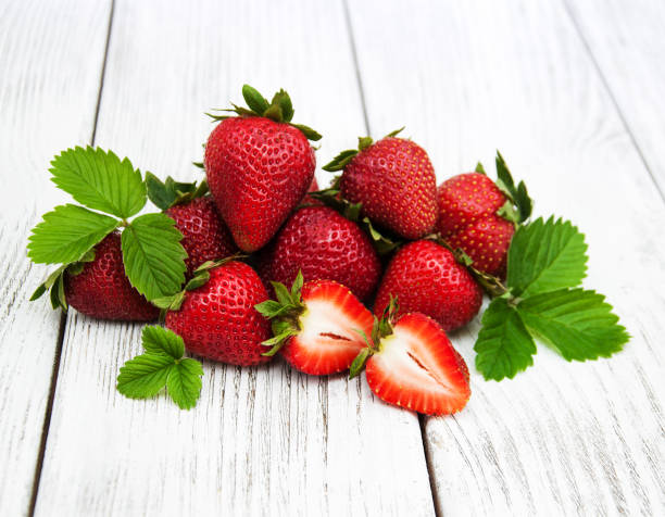 istock ripe strawberries on wooden table 648356590