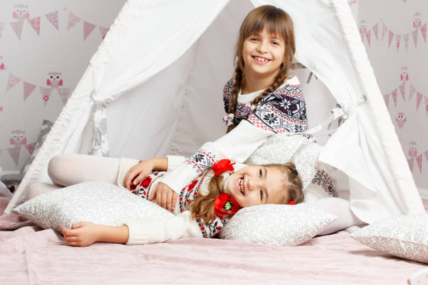 istock two girls who laugh, enjoy and play 648359306