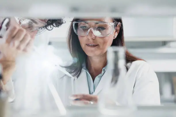 Photo of Scientist Using an Automatic Pipette