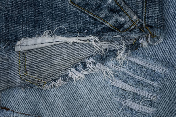 istock Close-up old and torn jean 648374732