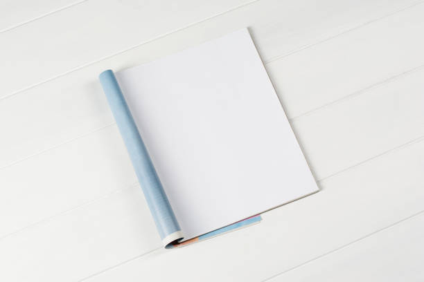 istock Mock-up magazines or catalog on wooden table background. 648380106