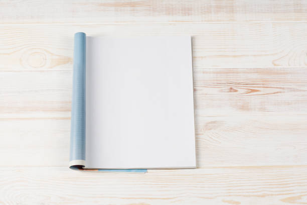 istock Mock-up magazines or catalog on wooden table background. 648380256
