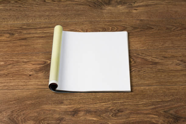 istock Mock-up magazines or catalog on wooden table background. 648380586