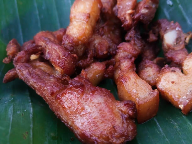 istock Deep fried streaky pork on banana leaf 648381560