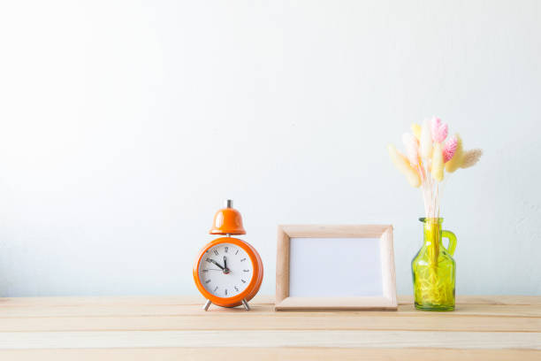 istock Indoor plant on wooden table and white wall 648388958