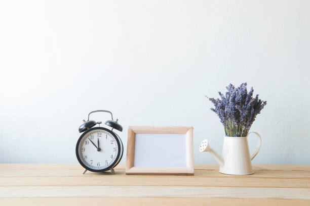 istock Indoor plant on wooden table and white wall 648389224