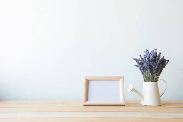 istock Indoor plant on wooden table and white wall 648389276