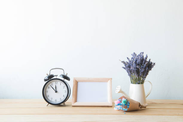 istock Indoor plant on wooden table and white wall 648389472