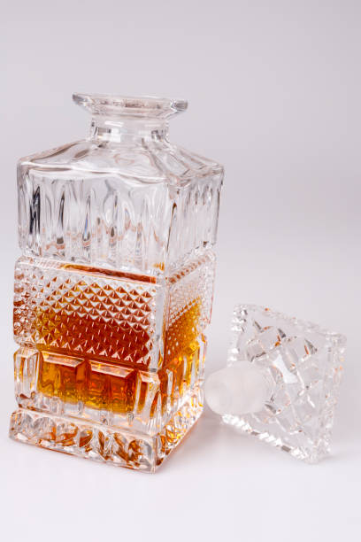 istock Whisky in beautiful glass bottle, rum, bourbon, cognac, brandy, glassware 648393912