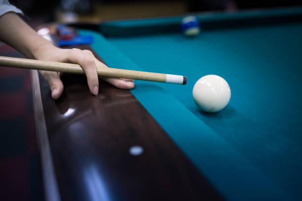 istock Young Japanese woman playing billiards 648397440