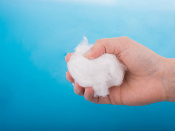 istock Hand holding some cotton in hand 648400832