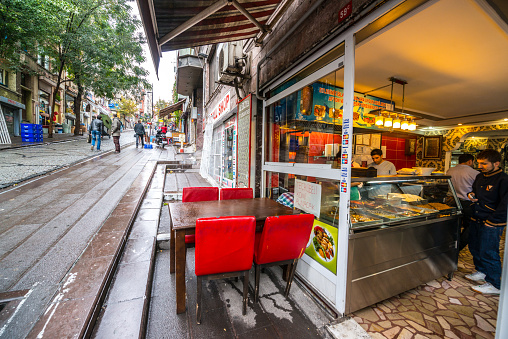 Prague, Czech Republic - 4 September 2022: People eating on the terrace of a restaurant