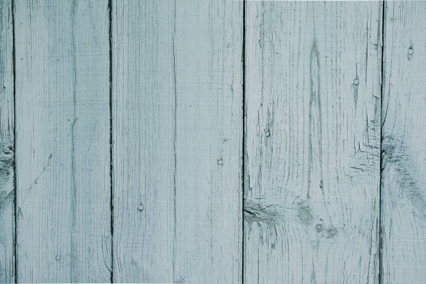 istock Light blue cracked wooden background with aged planks 648412910