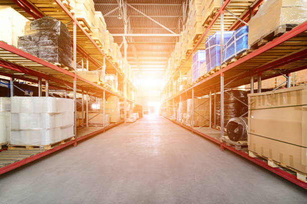 istock Long shelves with a variety of boxes and containers 648416382