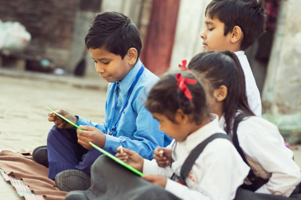 istock School children writing on slate 648419186