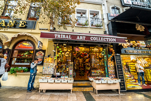 Istanbul, Turkey - October 27, 2014: Gift and food shops and people in Istanbul.