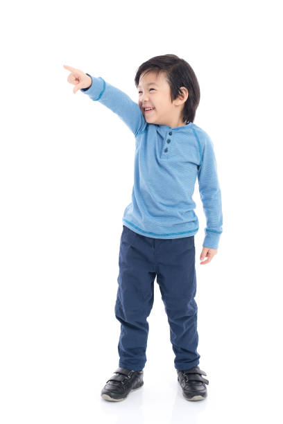 istock Asian child pointing on white background isolated 648420600