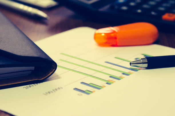 istock Financial paper charts 648424642