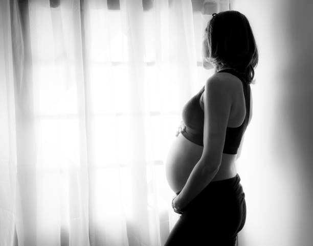 istock Mom looks out the window 648427550