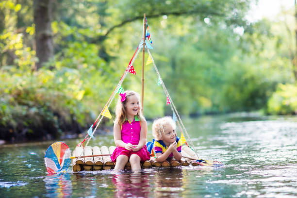 istock Kids on wooden raft 648427590