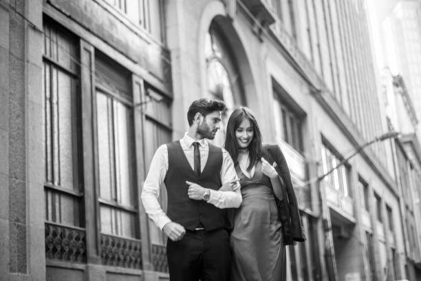 Modern and beautiful couple Two people, man and woman, heterosexual couple, lovely day in the city, black and white. falling in love photos stock pictures, royalty-free photos & images