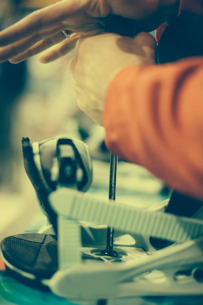 istock Snowboard repair shop worker adjust the bindings 648438968