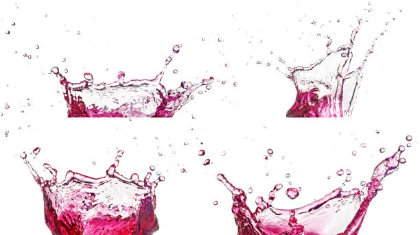 set of pink liquid splashes on white background stock photo