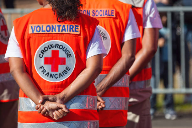 French Red Cross Saint Denis, Reunion Island - July 14 2016: Members of the “Croix Rouge Française” parading during Bastille Day. bastille day photos stock pictures, royalty-free photos & images