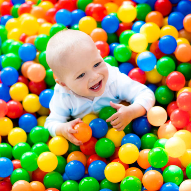 istock Child playing in ball pit on indoor playground 648449918