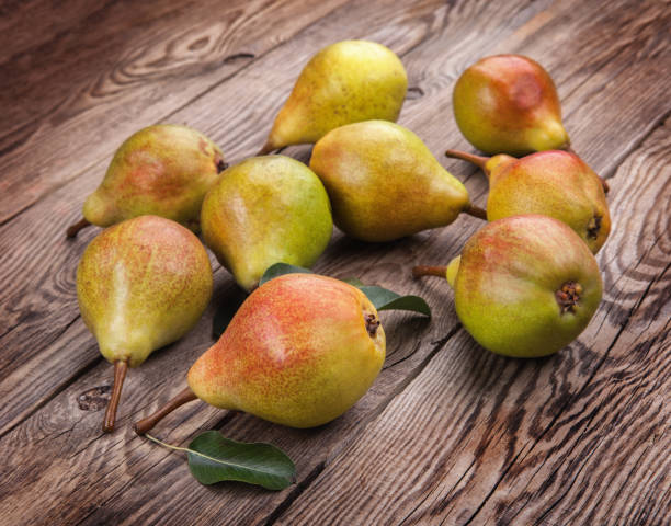 istock Tasty pears on the old board 648452670