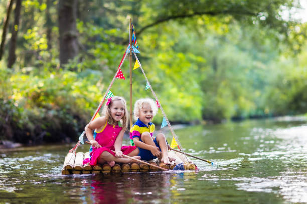 istock Kids on wooden raft 648456240