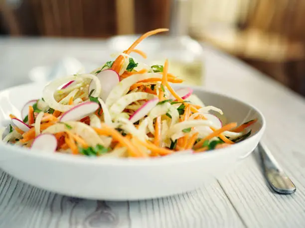 Home made healthy fennel slaw,mix freshness sliced fennel,carrots and coriander with olive oil and mustard.