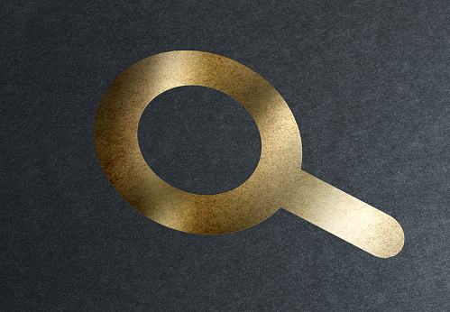 New generation search engine technologies rises. Golden magnifying glass symbol.